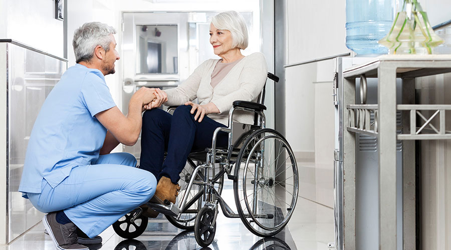 dr and woman in wheelchair